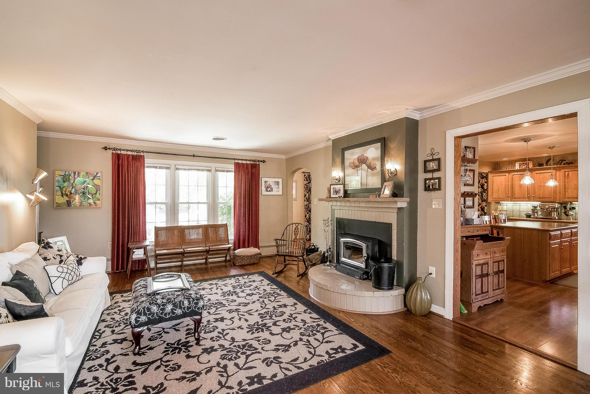 7707 Ridge Road Frederick, MD 21702 - Photo 11 of 30 a living room with furniture windows and a fireplace