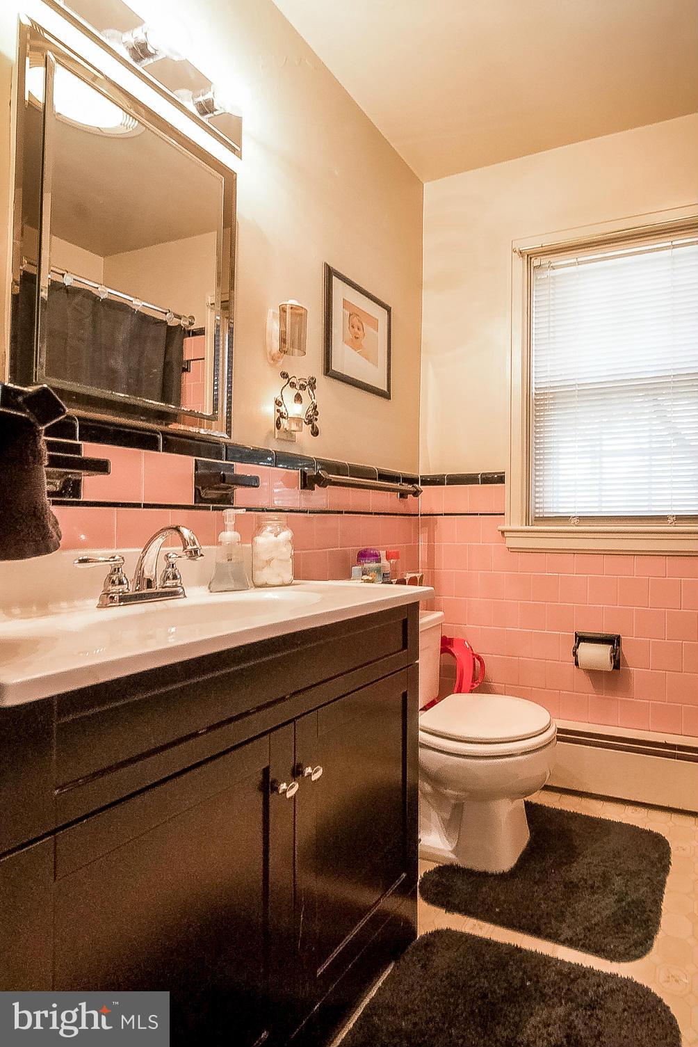 7707 Ridge Road Frederick, MD 21702 - Photo 13 of 30 a bathroom with a sink and a mirror