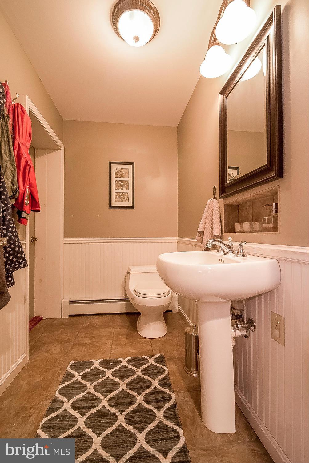 7707 Ridge Road Frederick, MD 21702 - Photo 19 of 30 a bathroom with a sink toilet and a mirror