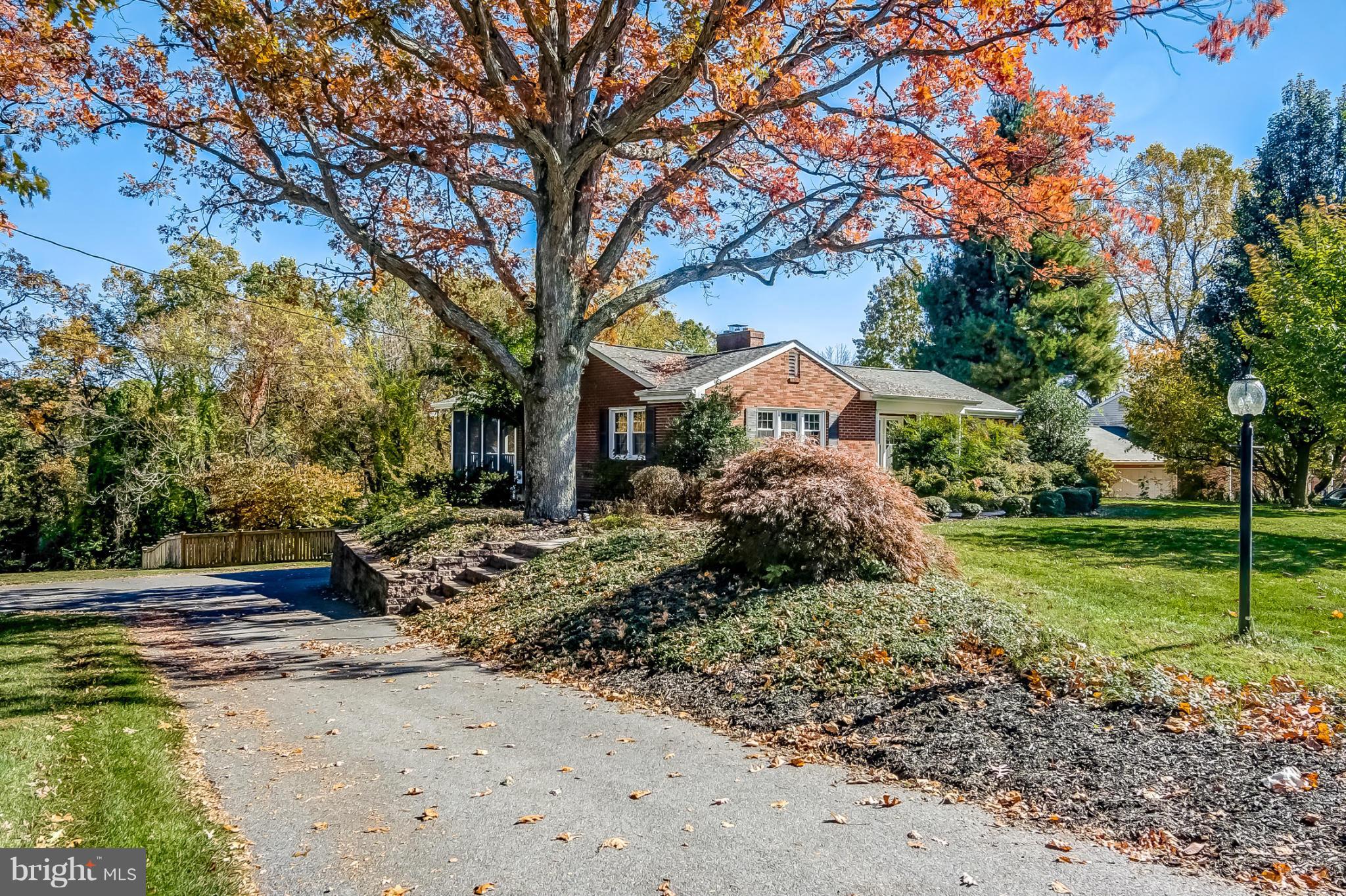7707 Ridge Road Frederick, MD 21702 - Photo 3 of 30 a front view of a house with garden
