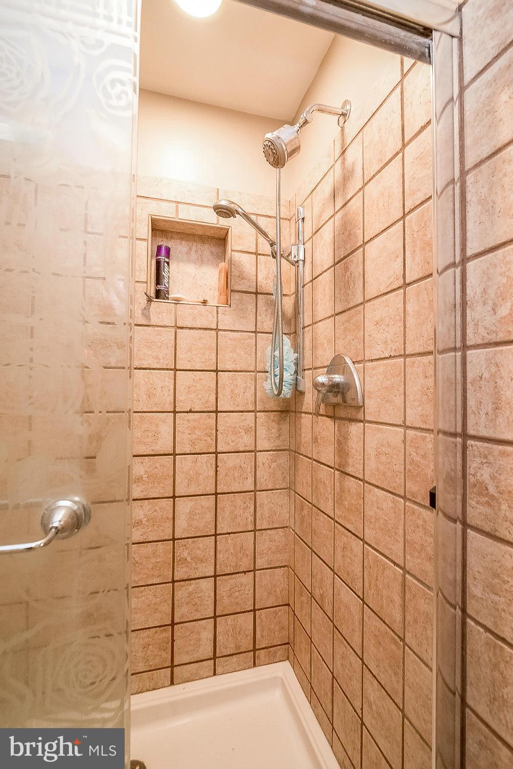 7707 Ridge Road Frederick, MD 21702 - Photo 21 of 30 a bathroom with a shower