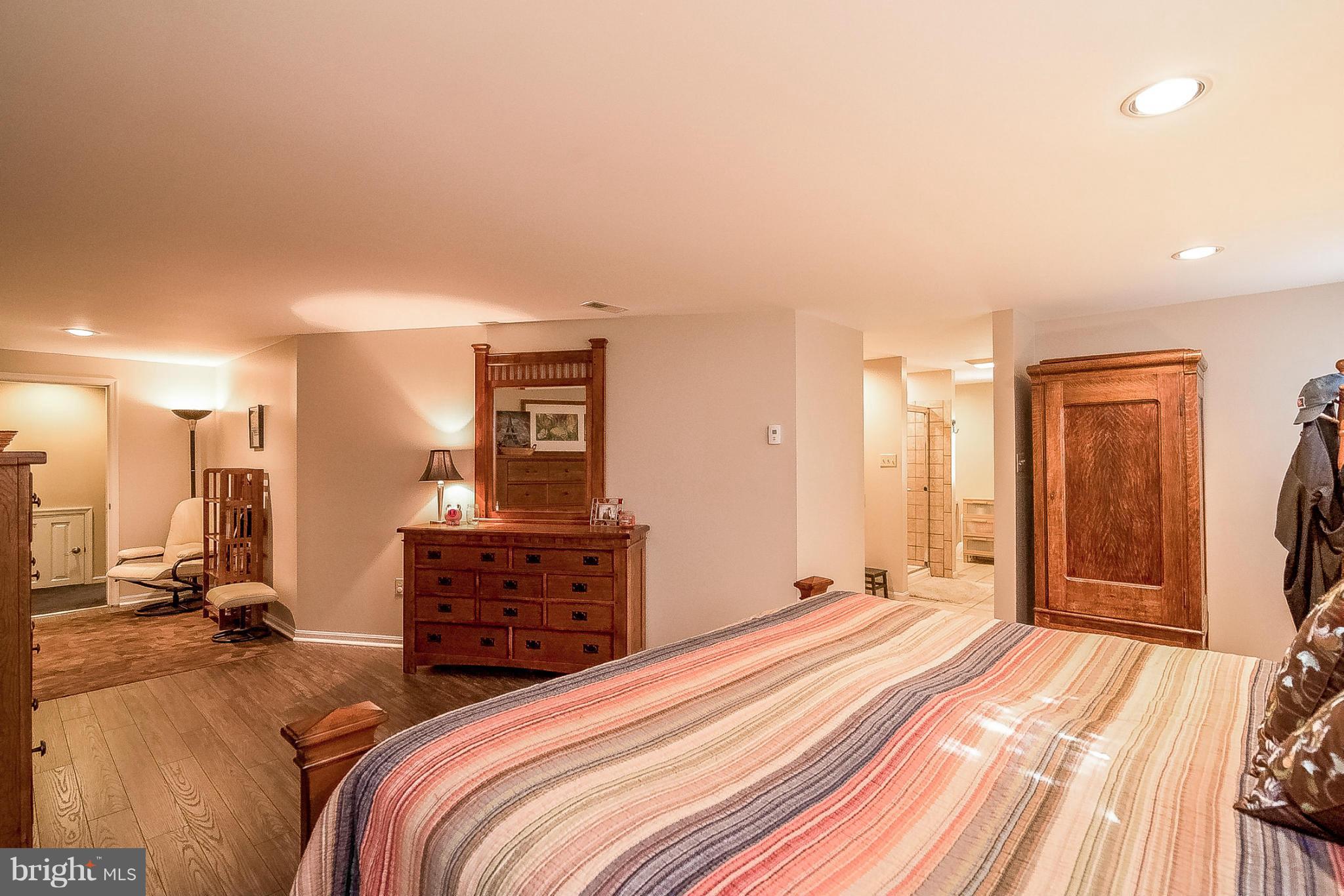 7707 Ridge Road Frederick, MD 21702 - Photo 24 of 30 a bedroom with a bed and a dresser