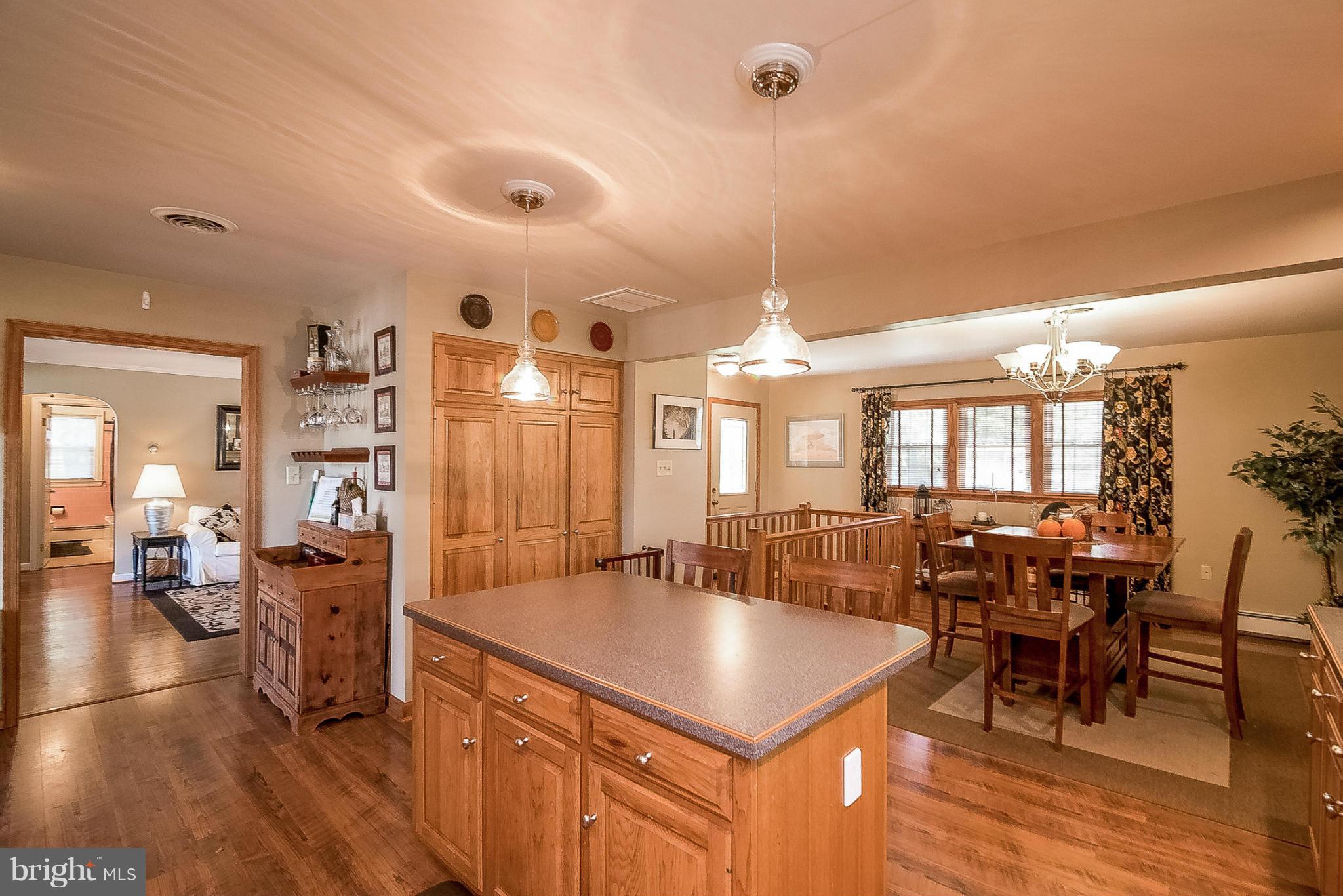 7707 Ridge Road Frederick, MD 21702 - Photo 6 of 30 a large kitchen with a table and chairs