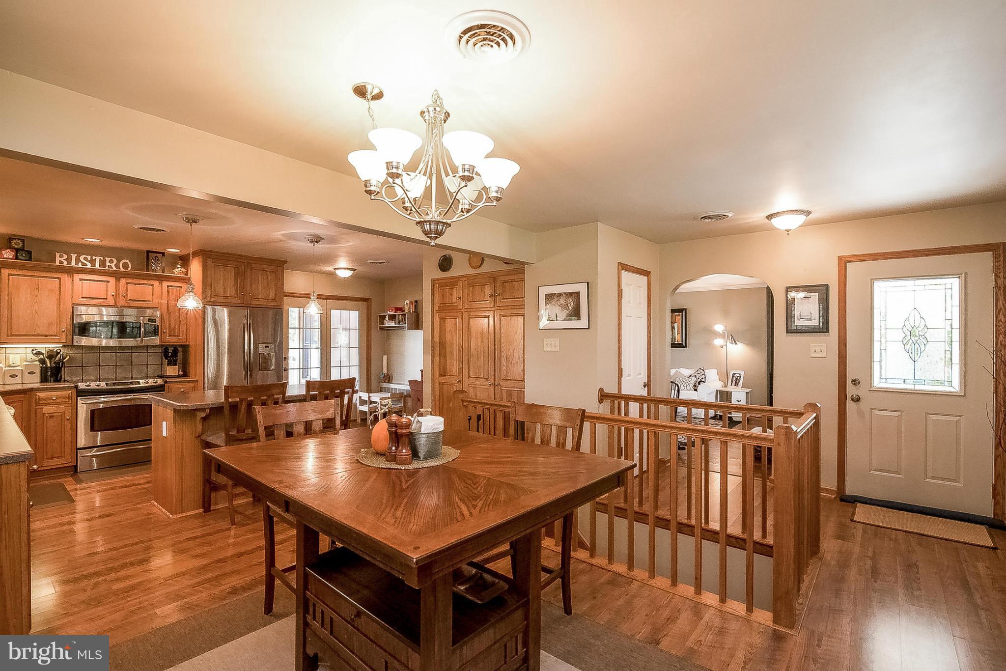 7707 Ridge Road Frederick, MD 21702 - Photo 8 of 30 a view of a dining room with furniture and wooden floor