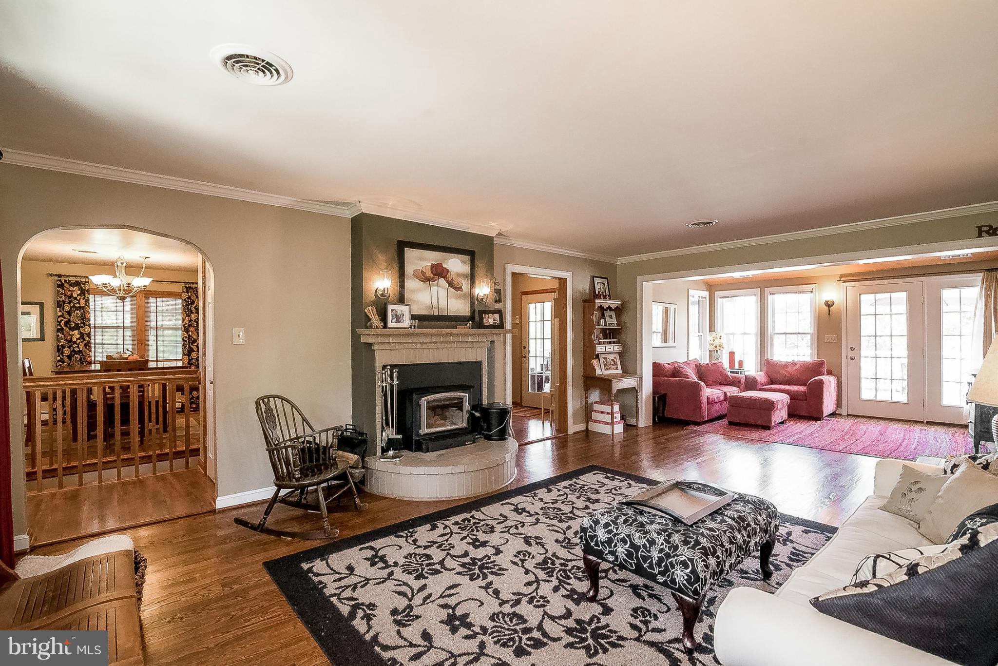 7707 Ridge Road Frederick, MD 21702 - Photo 10 of 30 a living room with furniture or couch and a fireplace