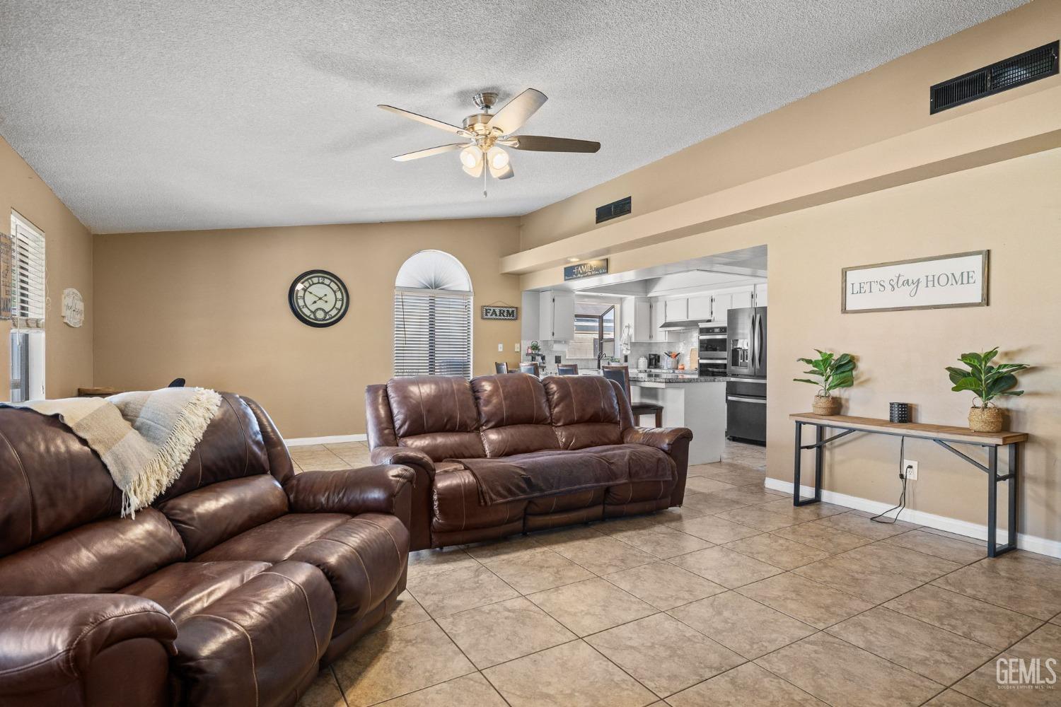 Undisclosed Address Bakersfield, CA 93311 - Photo 11 of 40 a living room with furniture and a large window