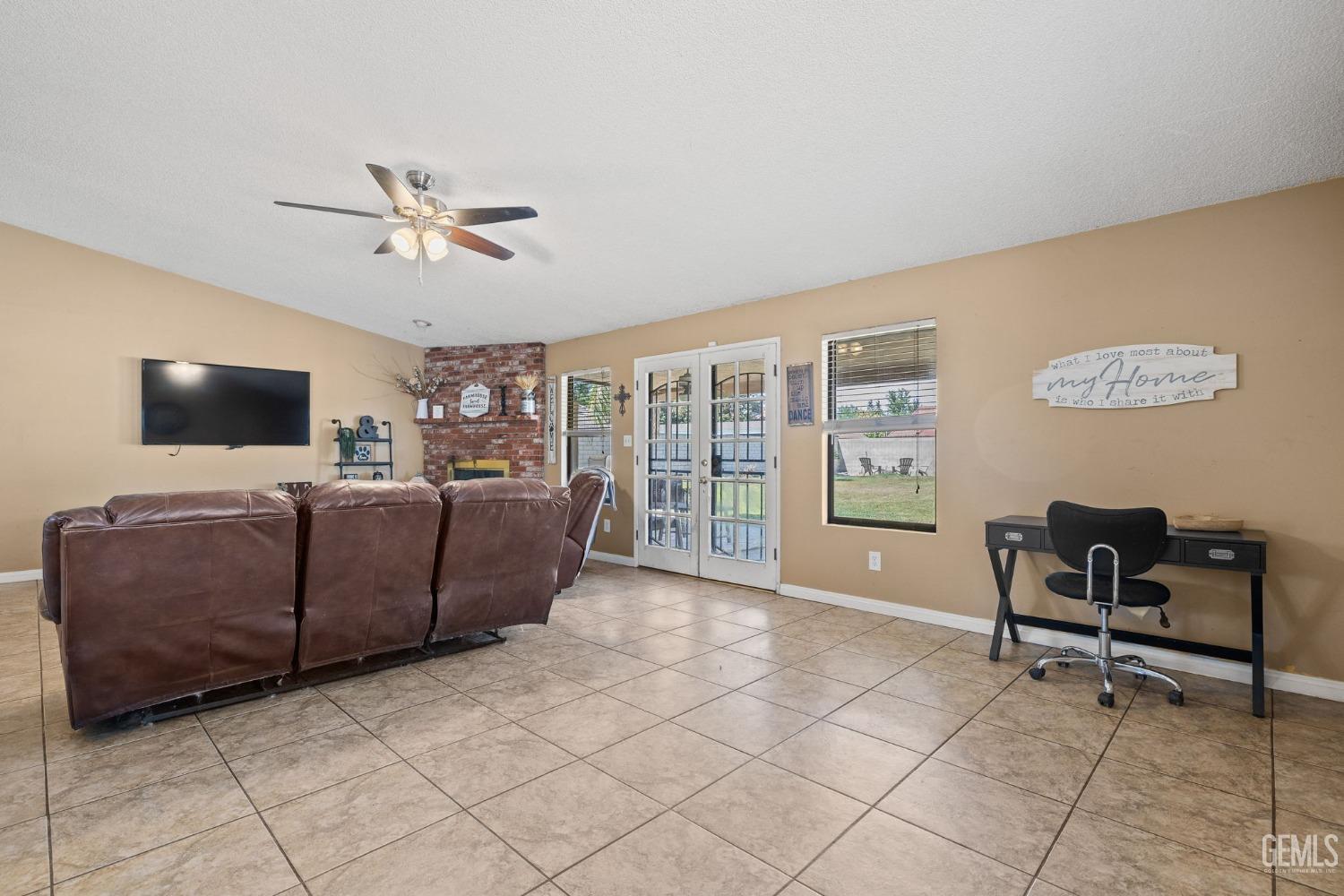 Undisclosed Address Bakersfield, CA 93311 - Photo 13 of 40 a living room with furniture and a flat screen tv