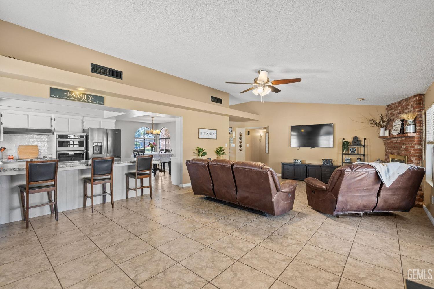 Undisclosed Address Bakersfield, CA 93311 - Photo 14 of 40 a living room with furniture and a table