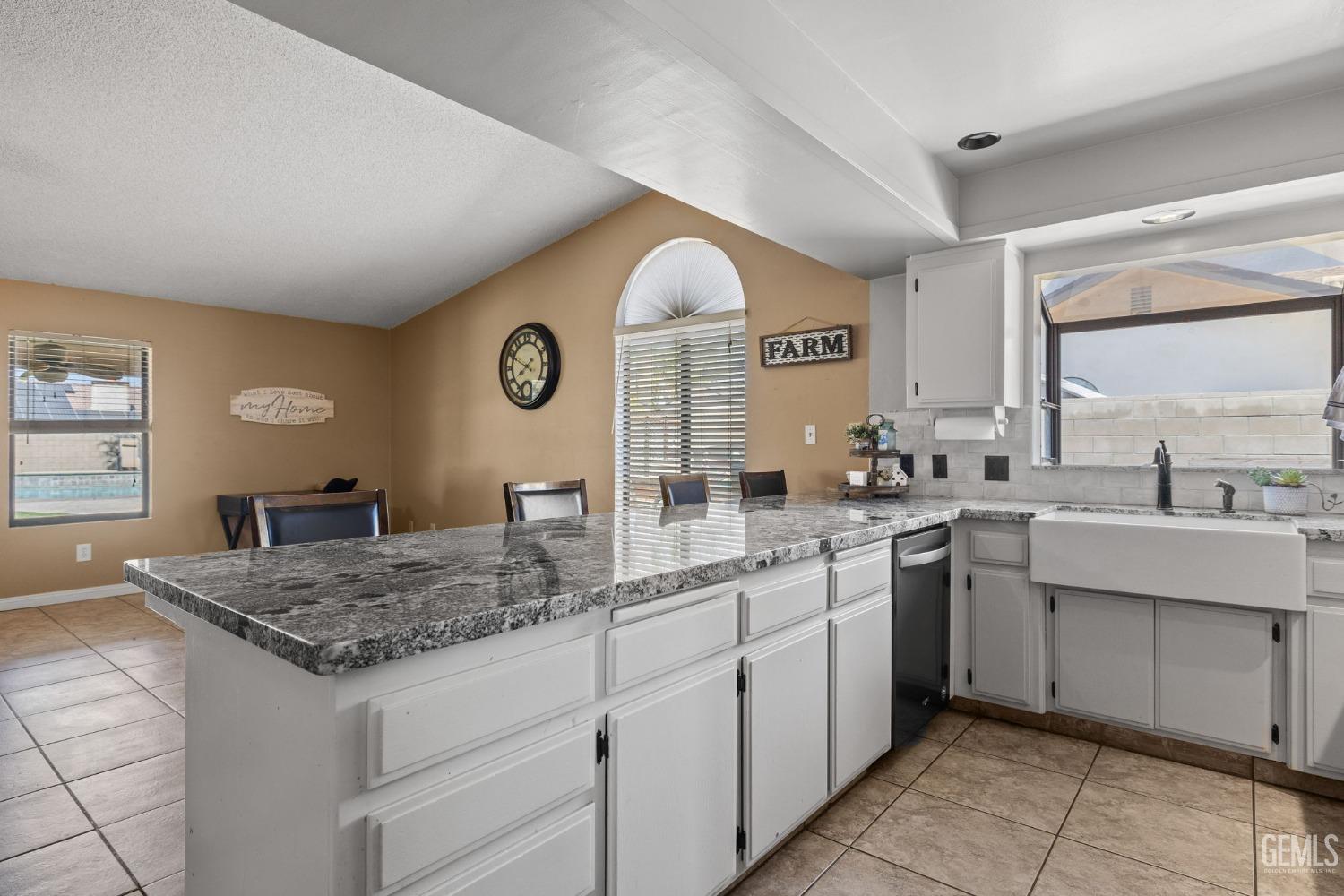 Undisclosed Address Bakersfield, CA 93311 - Photo 18 of 40 a kitchen with a sink and cabinets