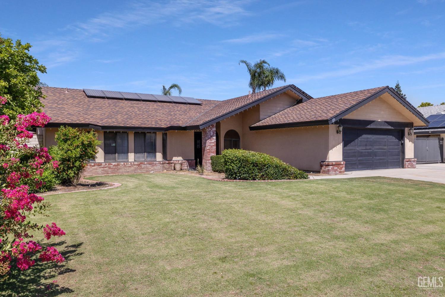 Undisclosed Address Bakersfield, CA 93311 - Photo 2 of 40 a front view of a house with a porch