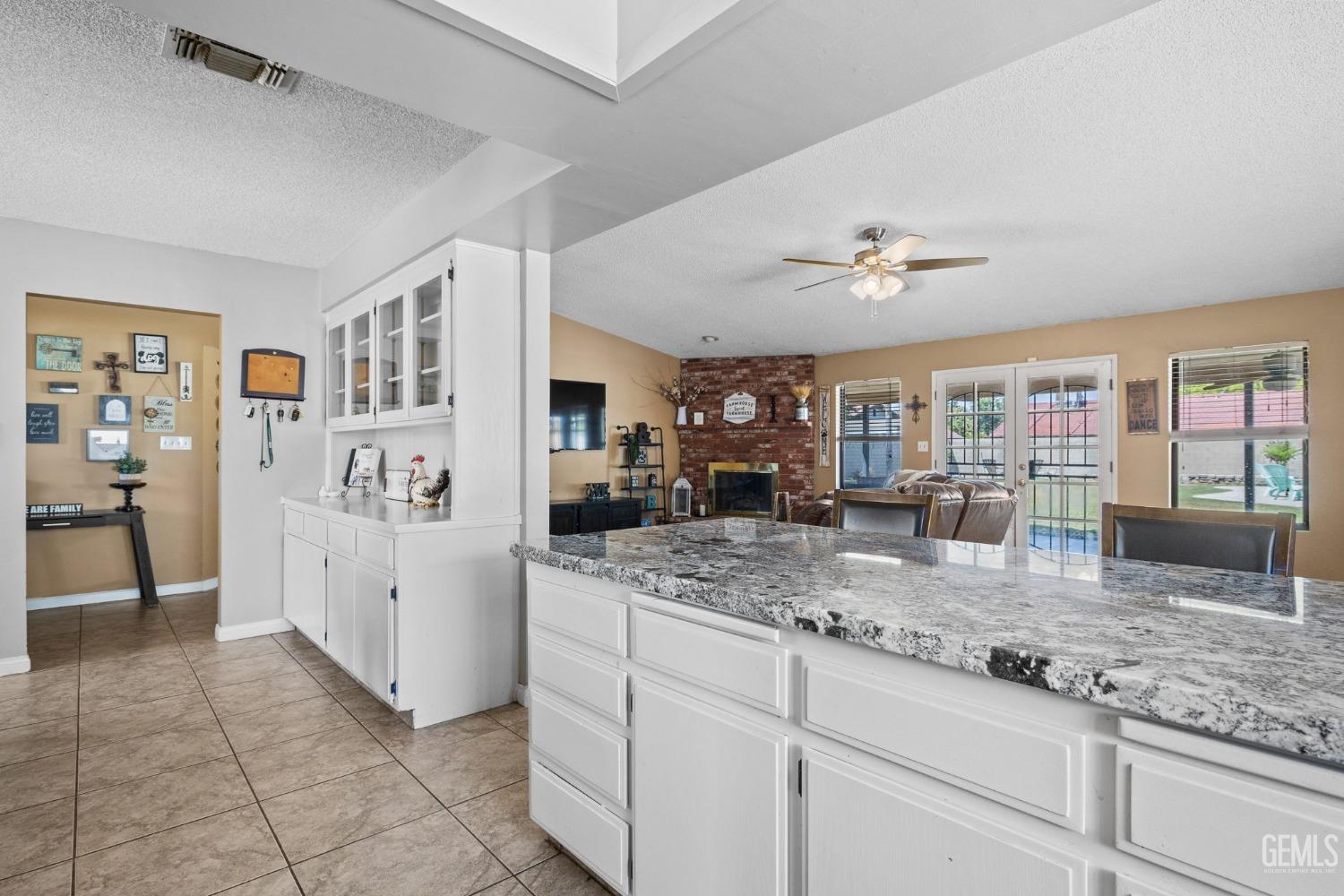 Undisclosed Address Bakersfield, CA 93311 - Photo 21 of 40 a kitchen with stainless steel appliances granite countertop a sink stove and refrigerator