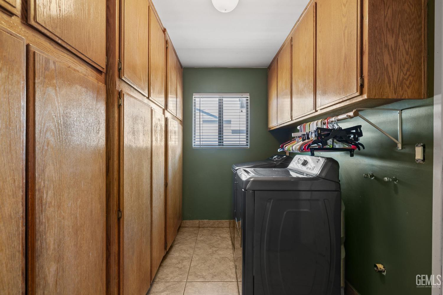 Undisclosed Address Bakersfield, CA 93311 - Photo 24 of 40 a utility room with closet dryer and washer