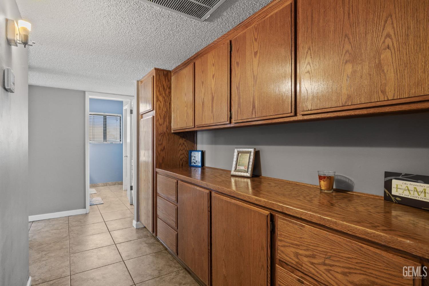 Undisclosed Address Bakersfield, CA 93311 - Photo 25 of 40 a kitchen with stainless steel appliances granite countertop a refrigerator and a sink