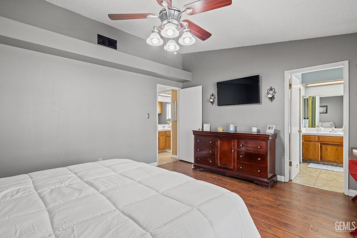 Undisclosed Address Bakersfield, CA 93311 - Photo 27 of 40 a bedroom with a bed and a flat screen tv