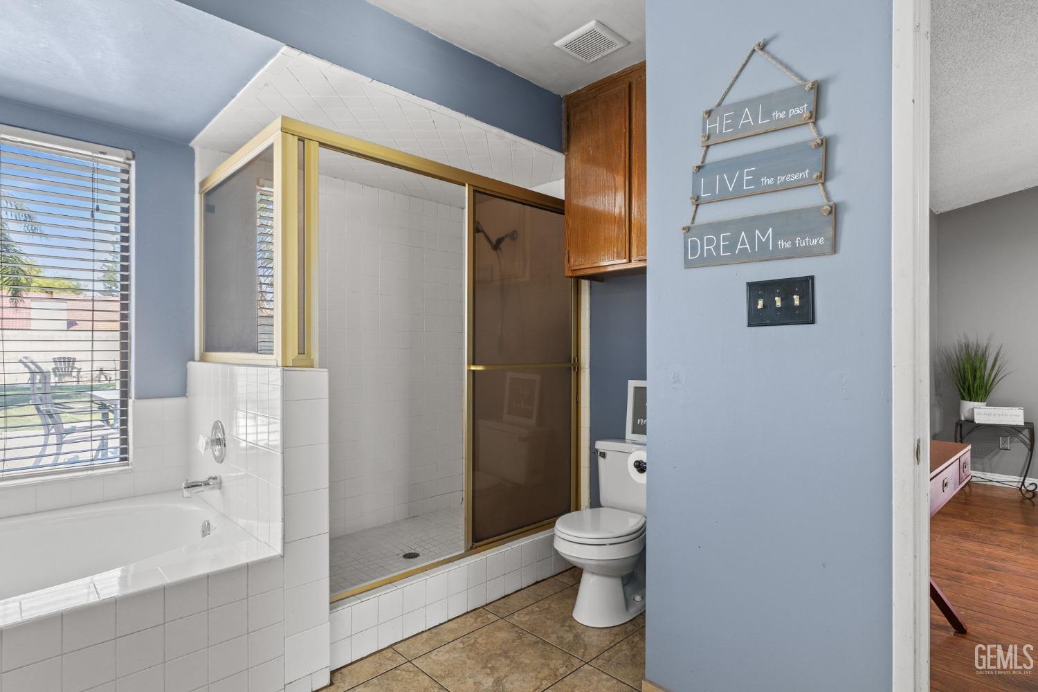 Undisclosed Address Bakersfield, CA 93311 - Photo 31 of 40 a bathroom with a toilet and a shower