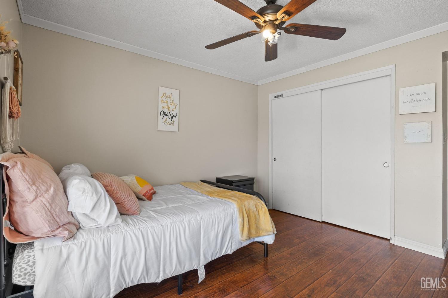 Undisclosed Address Bakersfield, CA 93311 - Photo 36 of 40 a bedroom with a bed and a ceiling fan