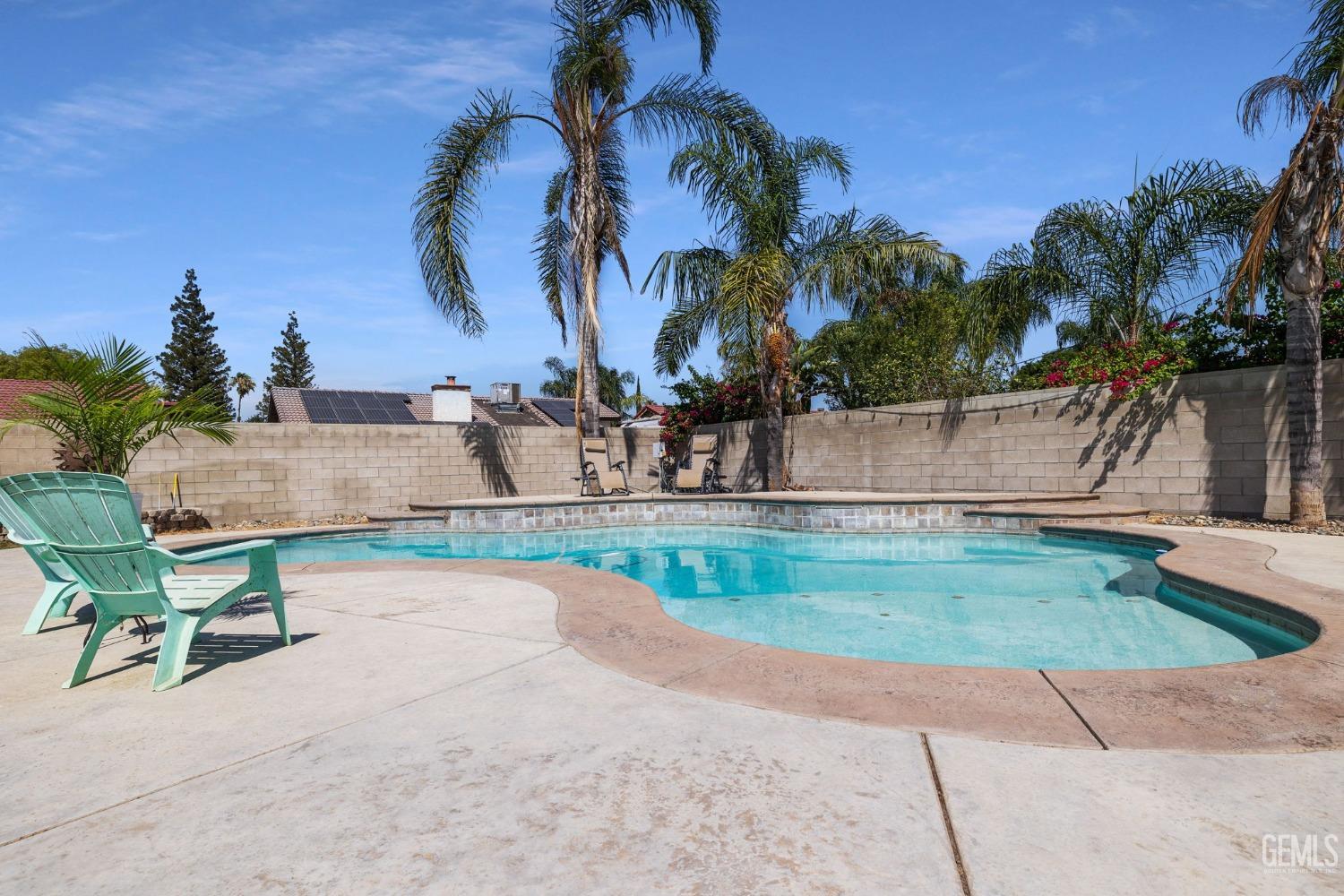 Undisclosed Address Bakersfield, CA 93311 - Photo 38 of 40 an outdoor space with swimming pool and lounge chair