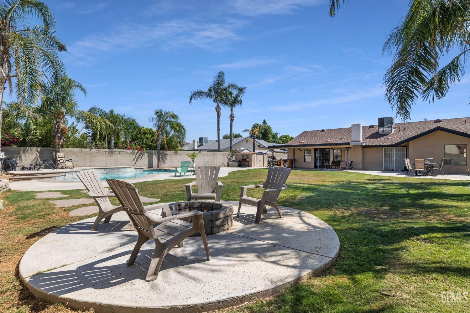 Undisclosed Address Bakersfield, CA 93311 - Photo 40 of 40 a swimming pool with outdoor seating yard and barbeque oven