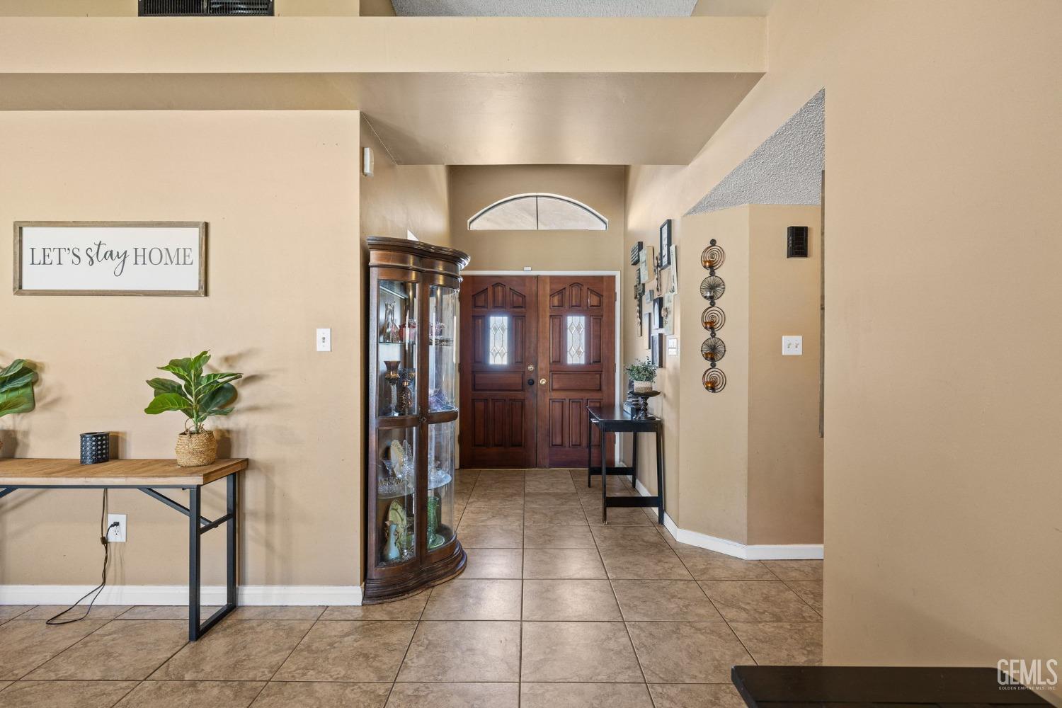 Undisclosed Address Bakersfield, CA 93311 - Photo 6 of 40 a view of a hallway and dining room