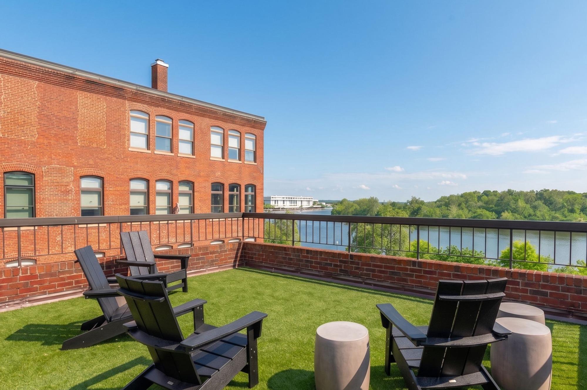 3299 K Street Northwest, Unit 401 Washington, DC 20007 - Photo 2 of 18 a balcony with chairs and lake view