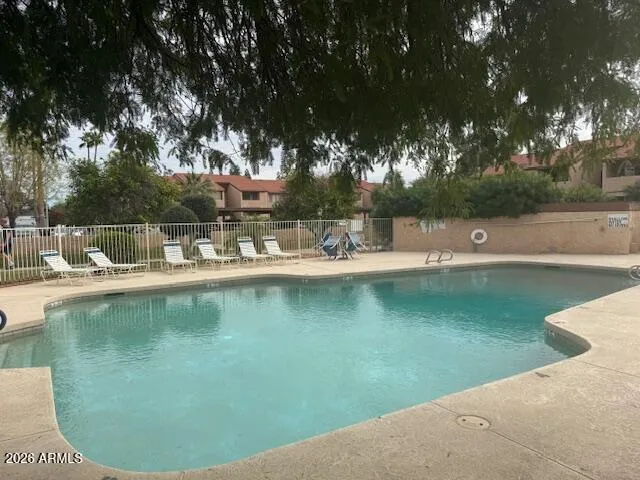 a view of a swimming pool with a patio