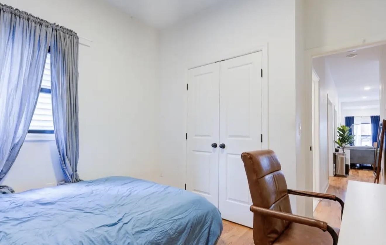306 Old Bergen Road, Unit 1 Jersey City, NJ 07305 - Photo 6 of 9 a bedroom with a bed and a chair