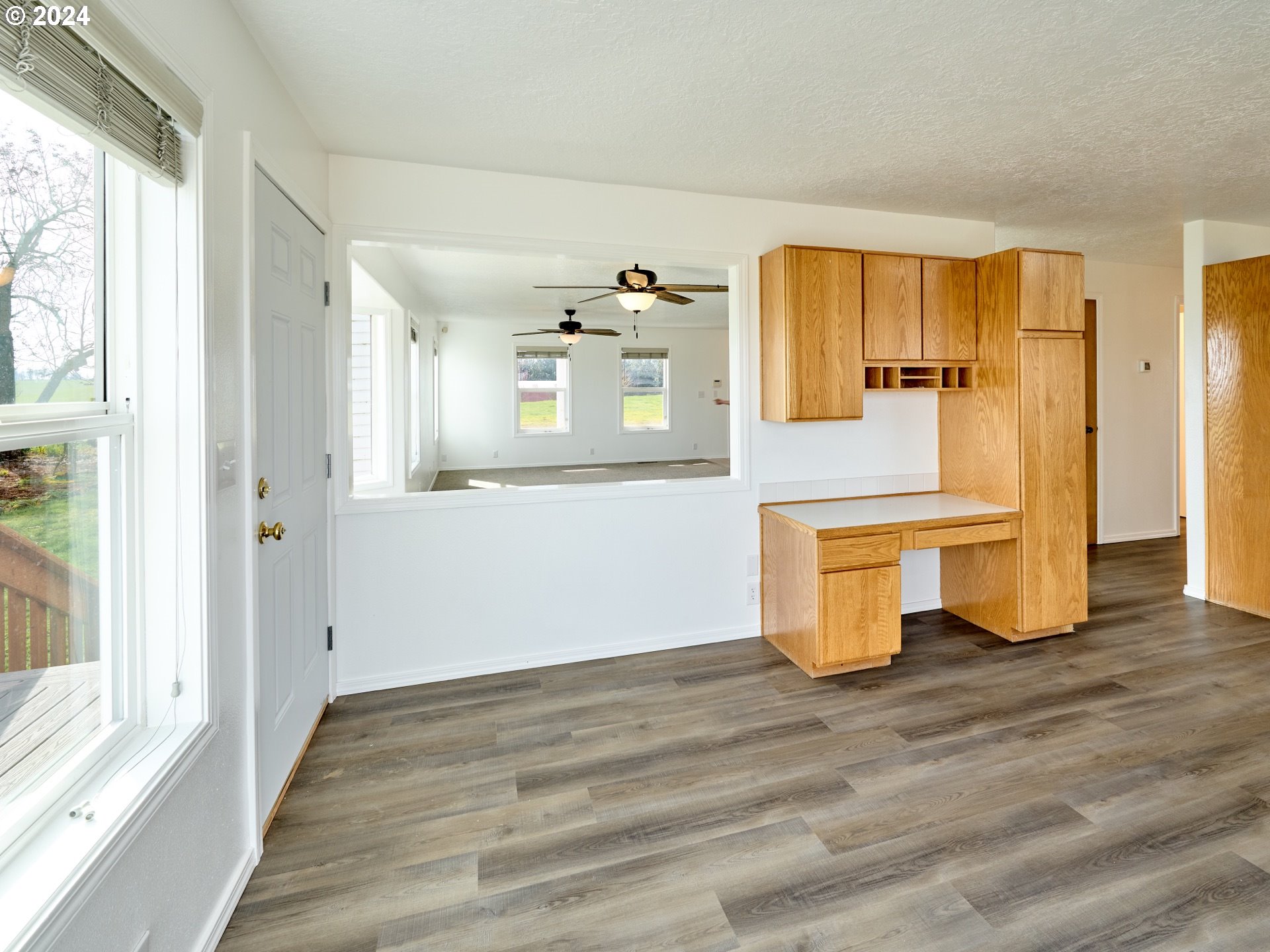12795 Beck Road Dallas, OR 97338 - Photo 11 of 48 a view of a kitchen with wooden floor and electronic appliances