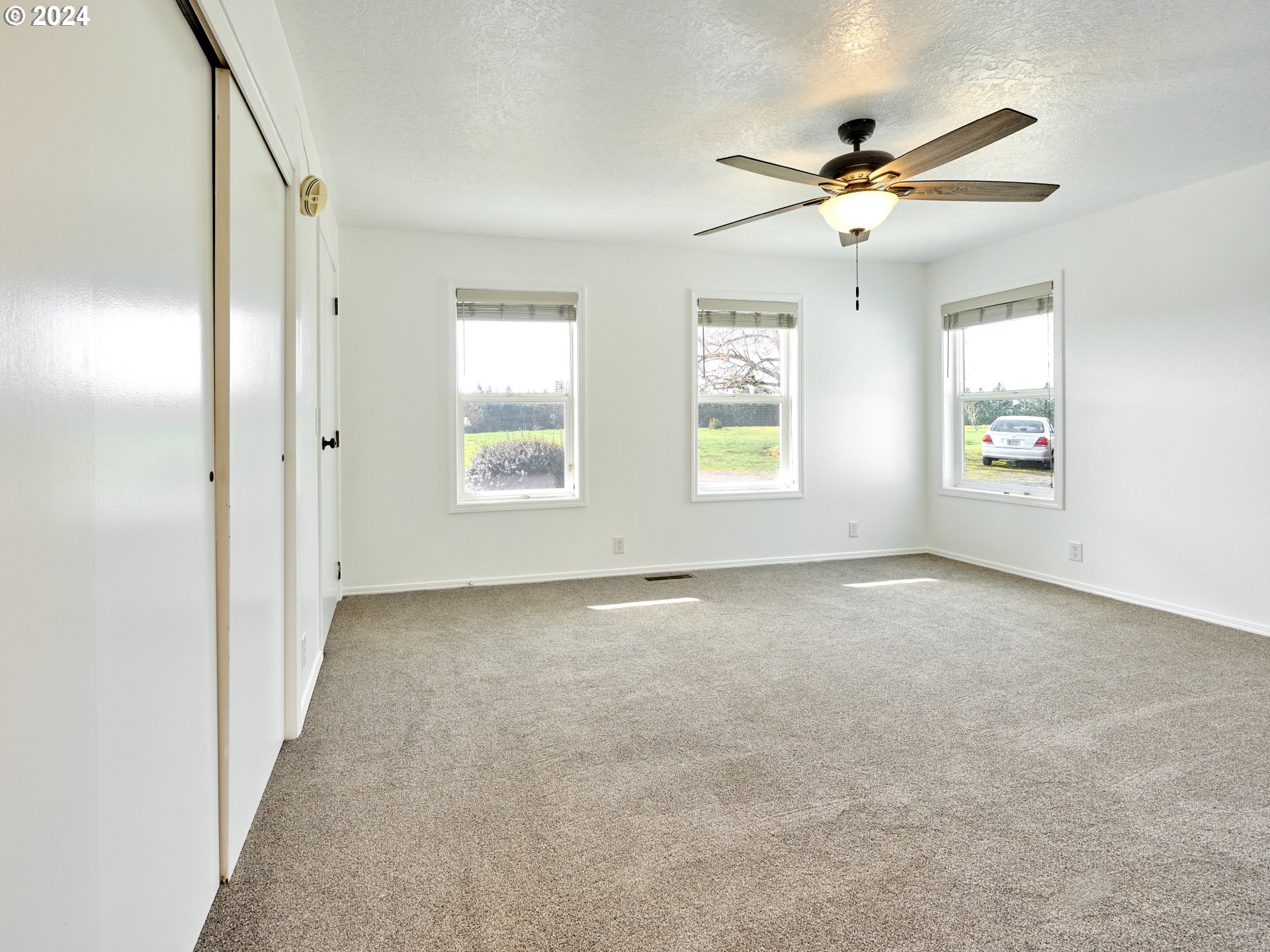 12795 Beck Road Dallas, OR 97338 - Photo 12 of 48 a view of an empty room with a window