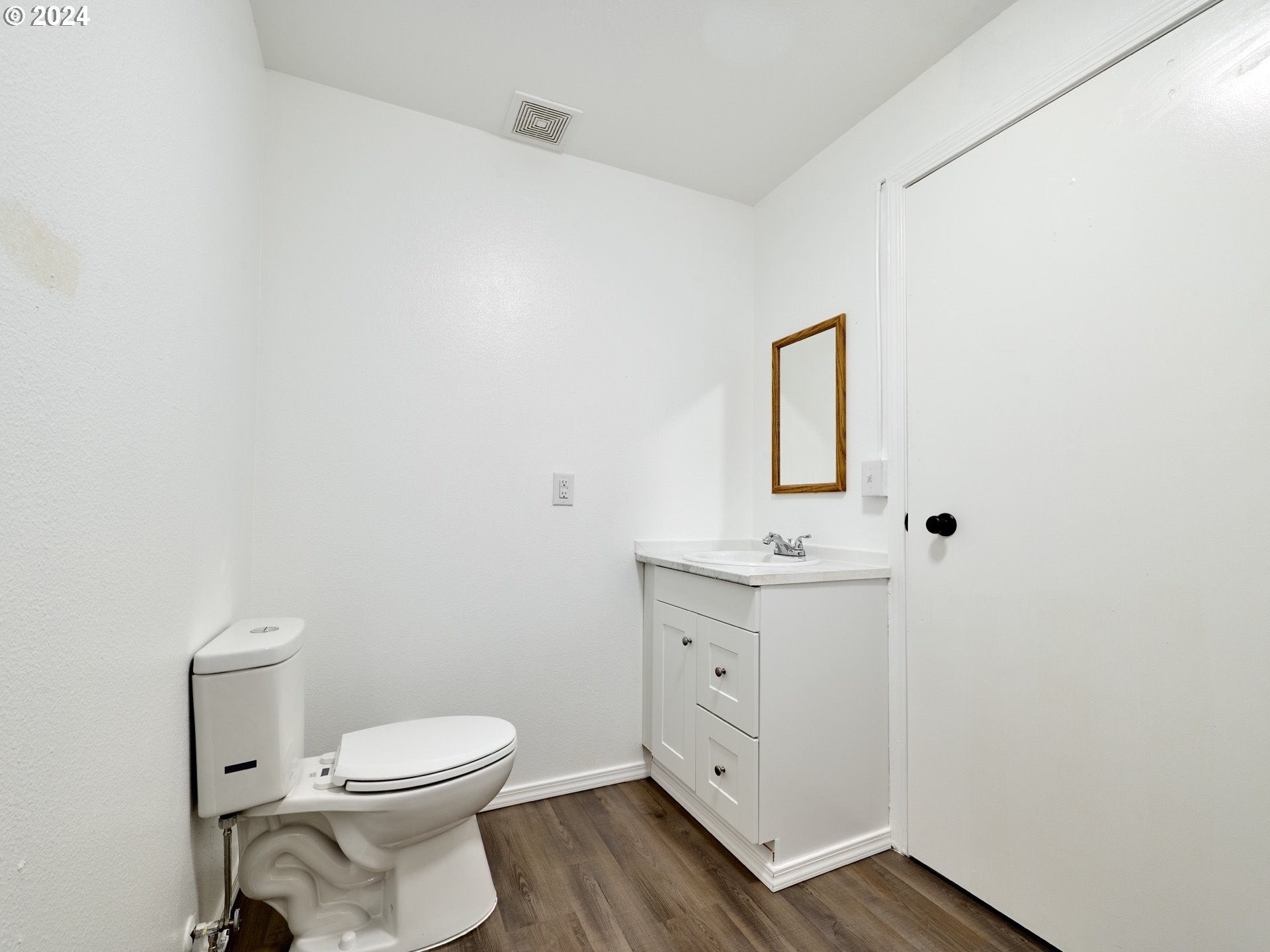 12795 Beck Road Dallas, OR 97338 - Photo 16 of 48 a bathroom with a toilet a sink and mirror