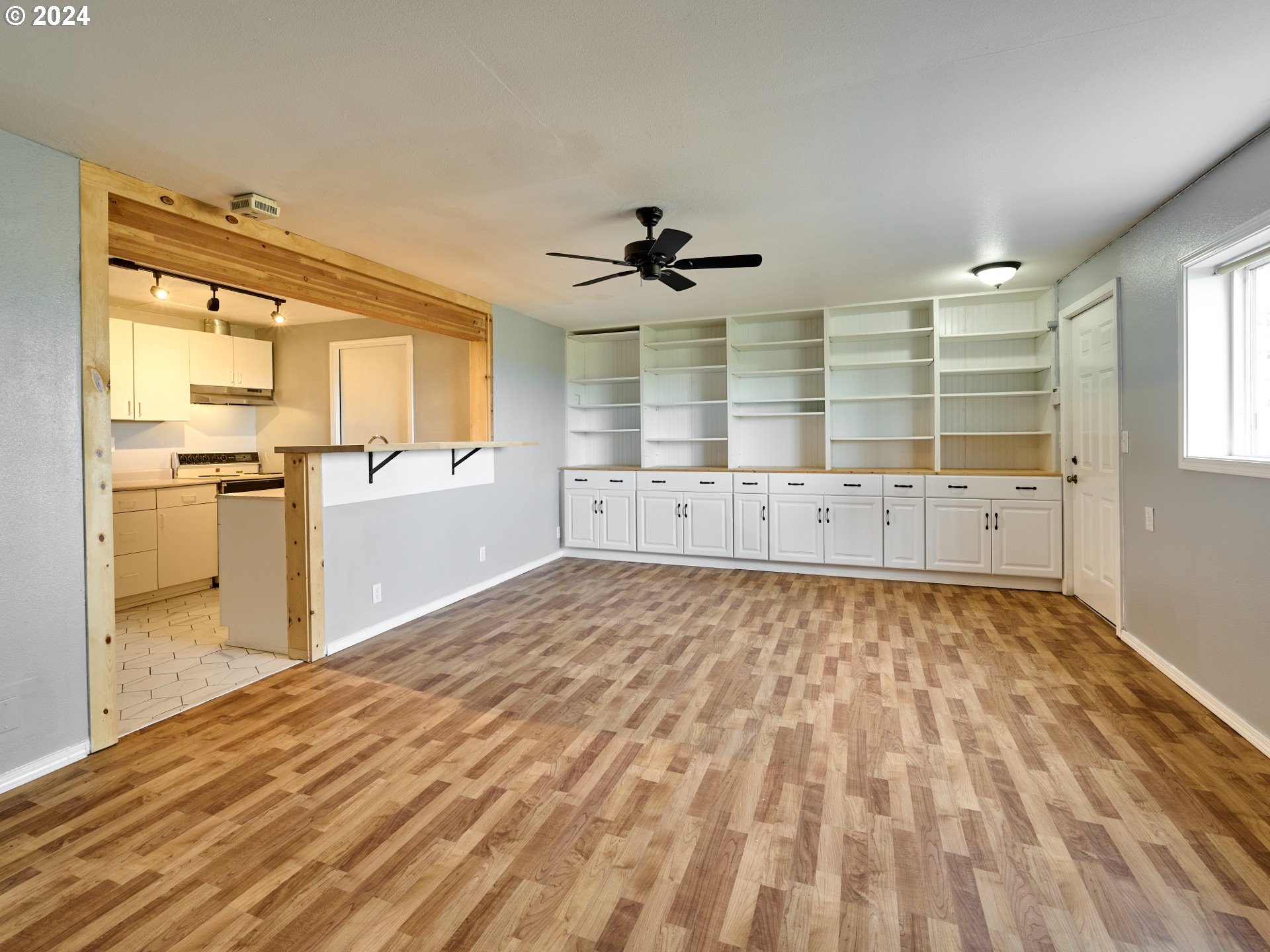 12795 Beck Road Dallas, OR 97338 - Photo 23 of 48 a view of empty room with wooden floor and fan