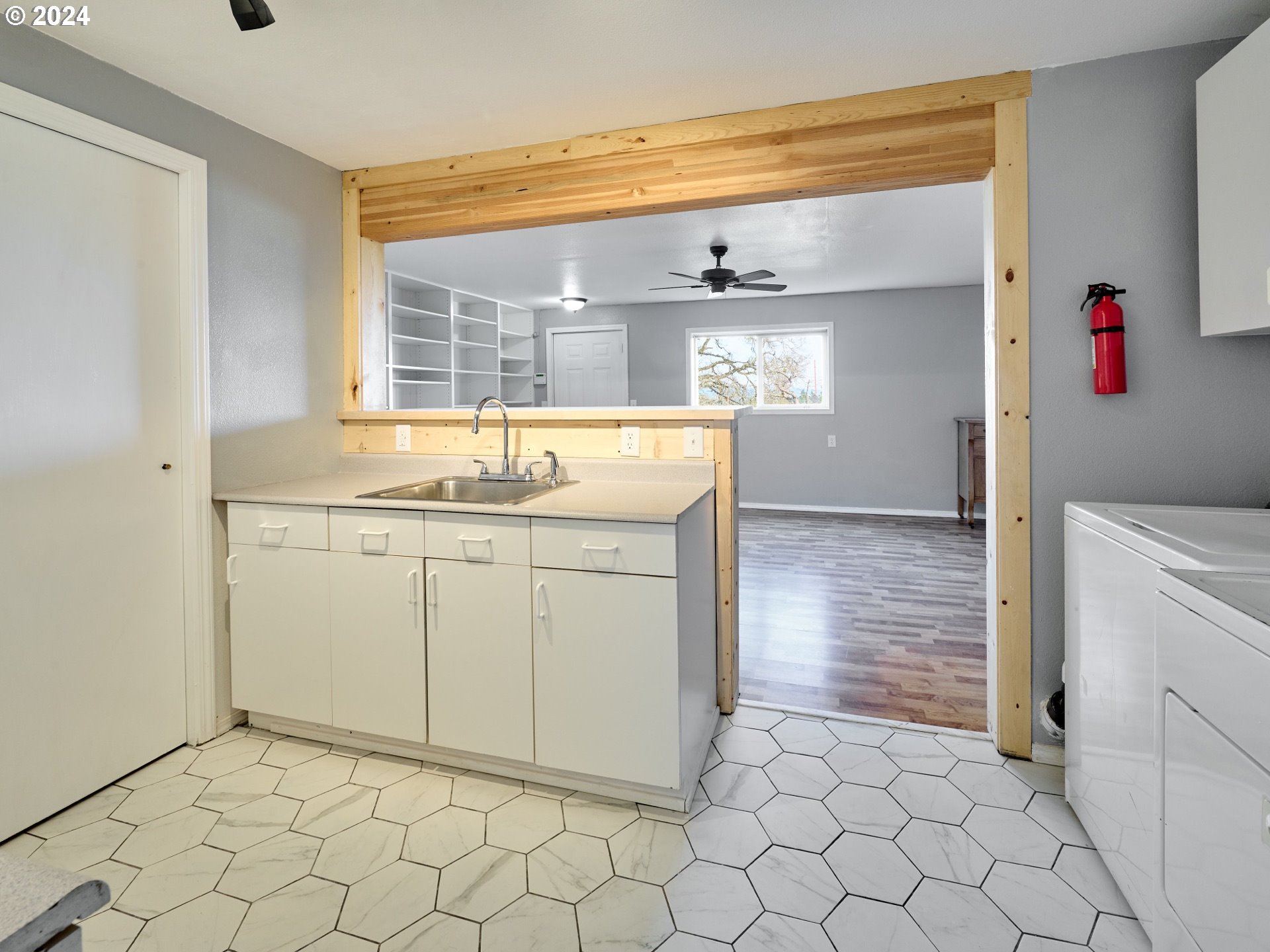 12795 Beck Road Dallas, OR 97338 - Photo 24 of 48 a utility room with cabinets washer and dryer