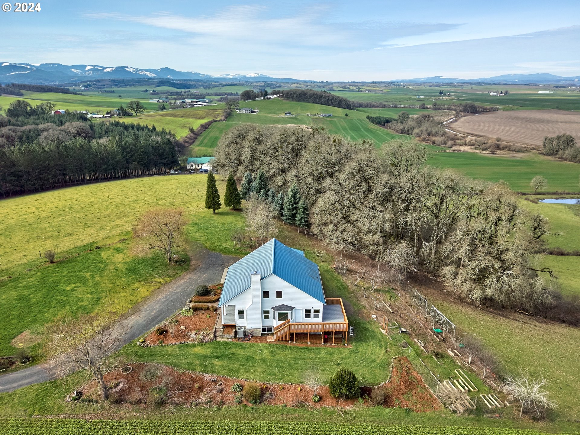 12795 Beck Road Dallas, OR 97338 - Photo 46 of 48 an aerial view of a house with a garden and lake view