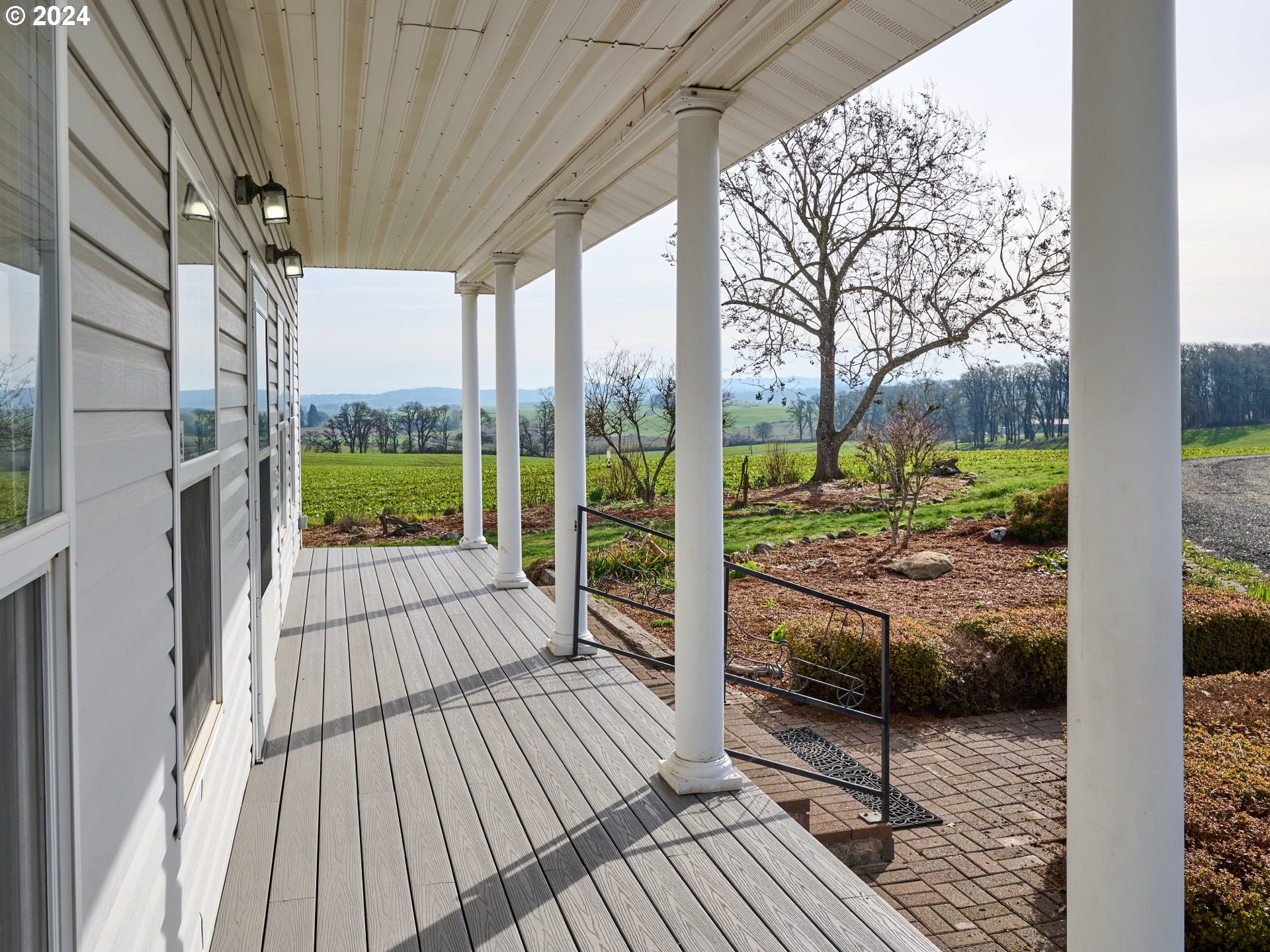 12795 Beck Road Dallas, OR 97338 - Photo 5 of 48 a view of a porch with wooden floor and outdoor space