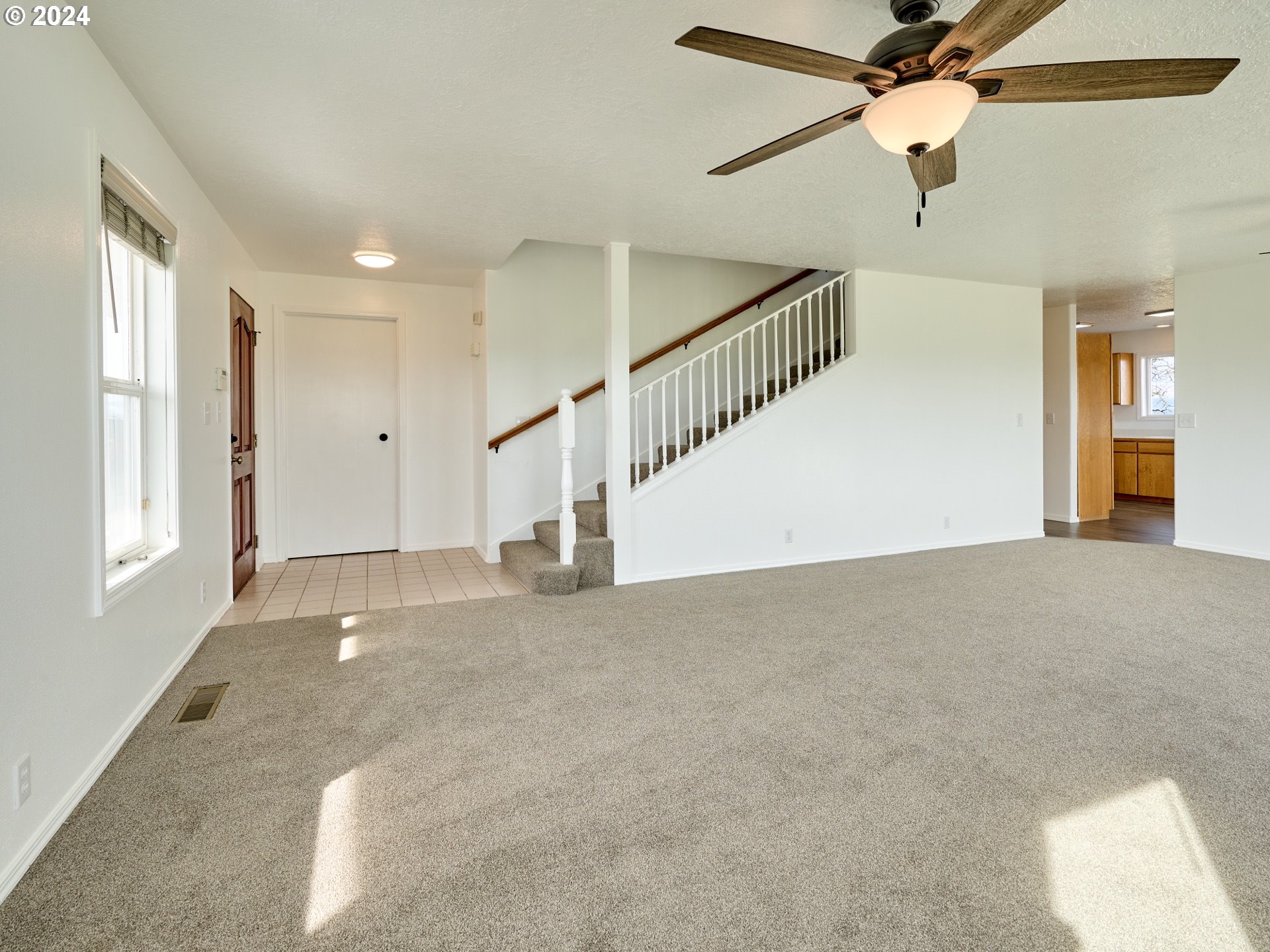 12795 Beck Road Dallas, OR 97338 - Photo 6 of 48 a view of an empty room with a window