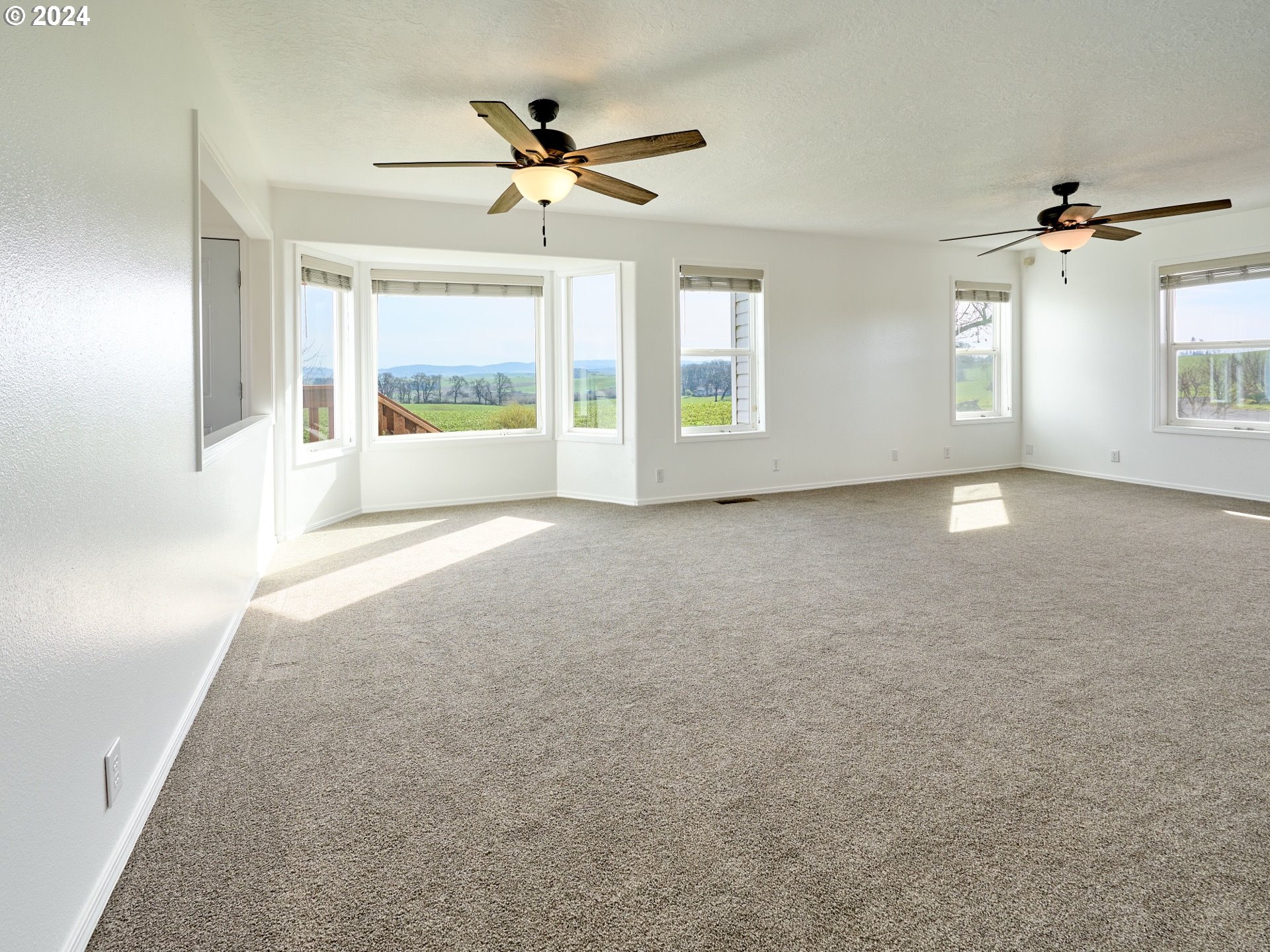12795 Beck Road Dallas, OR 97338 - Photo 7 of 48 a view of an empty room with a window
