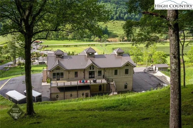 a view of a house with a yard porch and sitting area