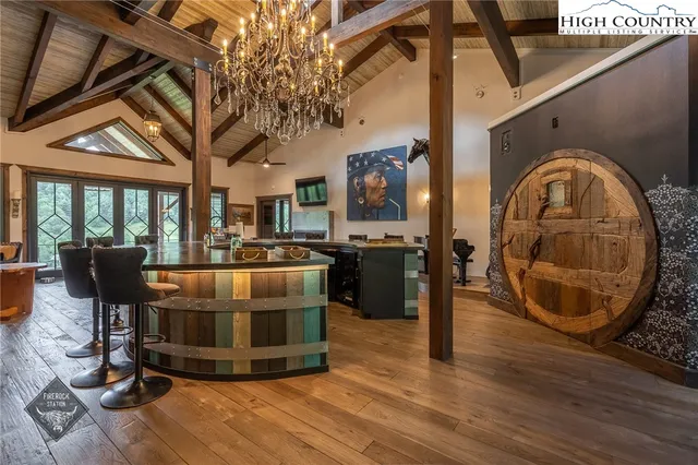 a view of living room with furniture and wooden floor