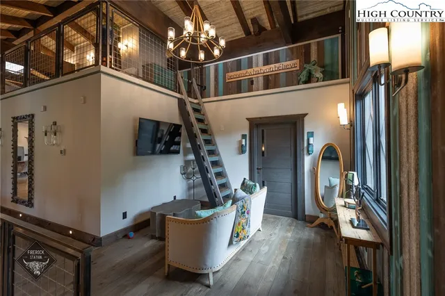 a view of a living room and entryway