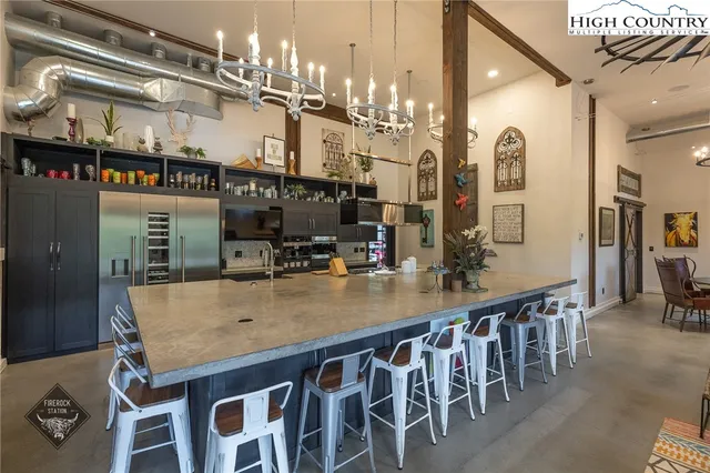 a kitchen with a table and chairs in it