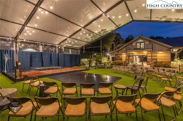 a view of a chairs and table in the patio