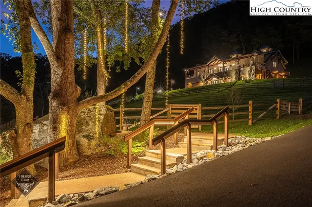 a view of a swimming pool with a patio and a garden