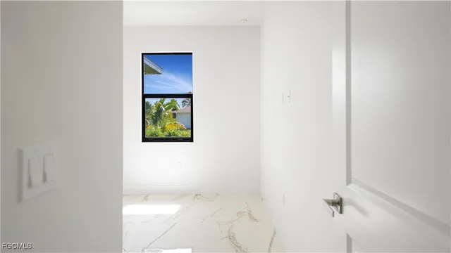a picture of a bathroom with a toilet and mirror