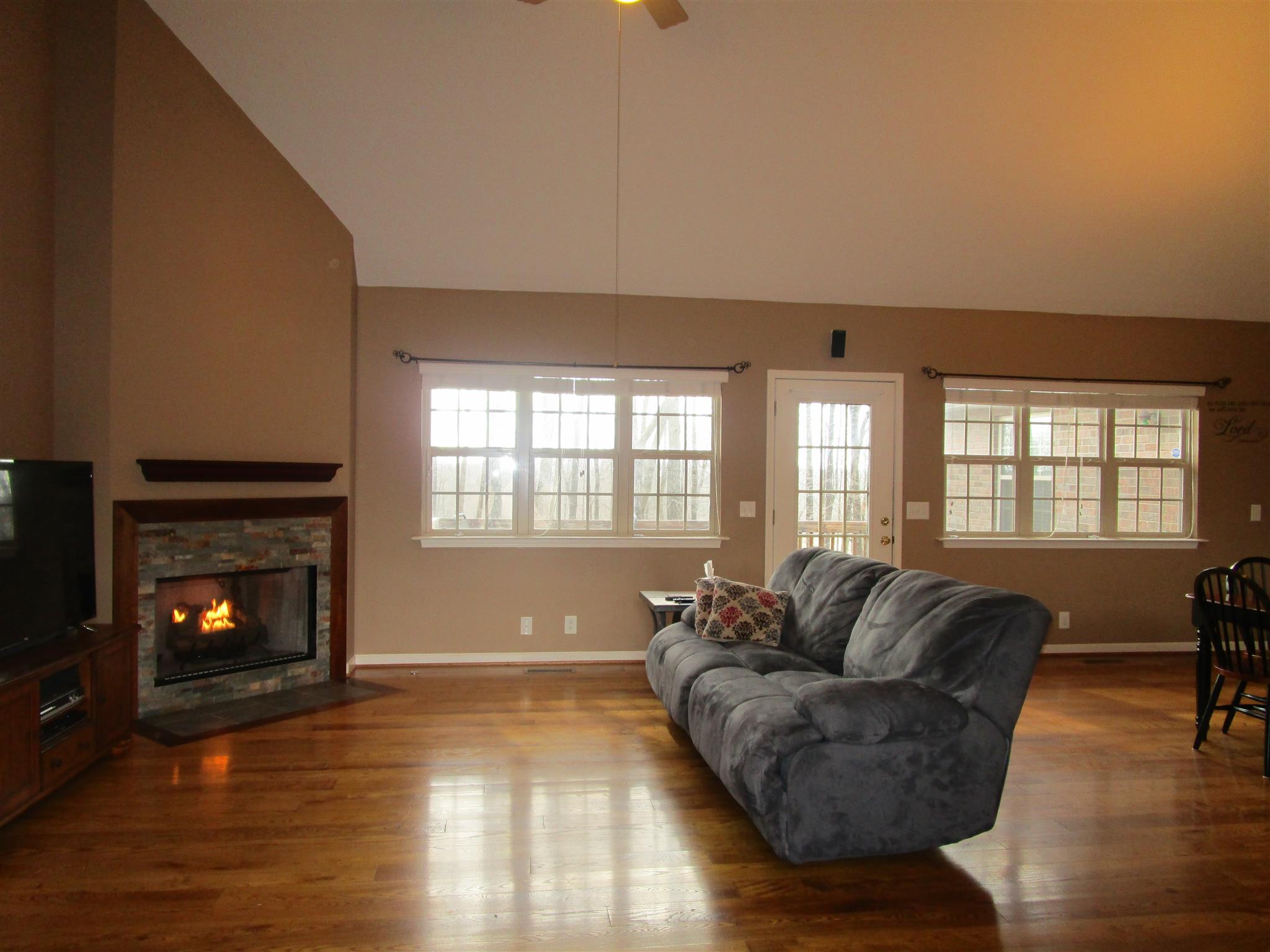 136 North Leath Road Portland, TN 37148 - Photo 13 of 30 a living room with furniture and a fireplace