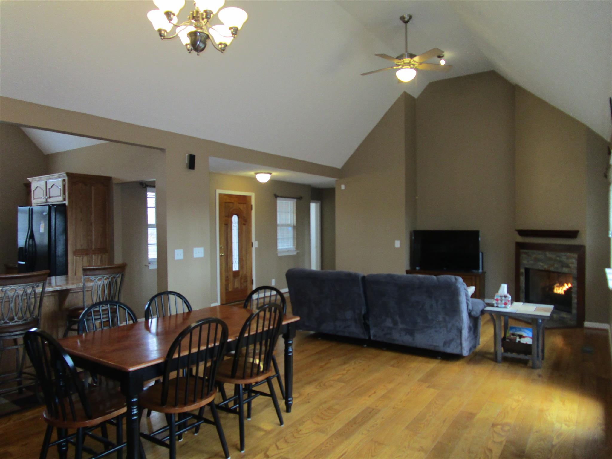 136 North Leath Road Portland, TN 37148 - Photo 15 of 30 a view of a dining room with furniture and a chandelier