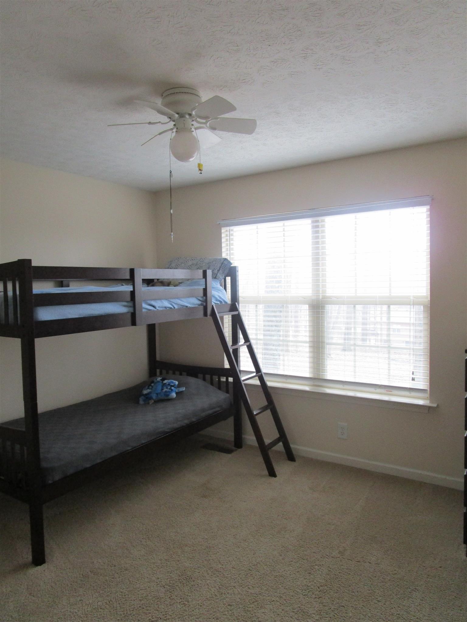 136 North Leath Road Portland, TN 37148 - Photo 21 of 30 a room with gym equipment and windows