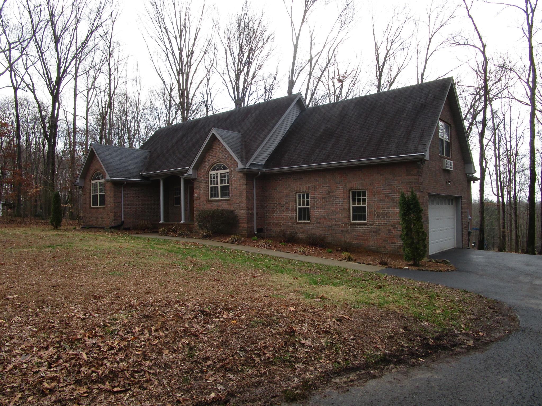 136 North Leath Road Portland, TN 37148 - Photo 3 of 30 a front view of a house with garden