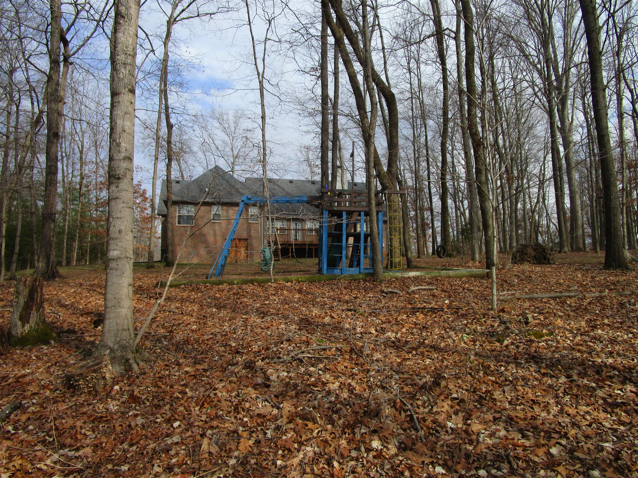 136 North Leath Road Portland, TN 37148 - Photo 4 of 30 a view of a backyard with large trees