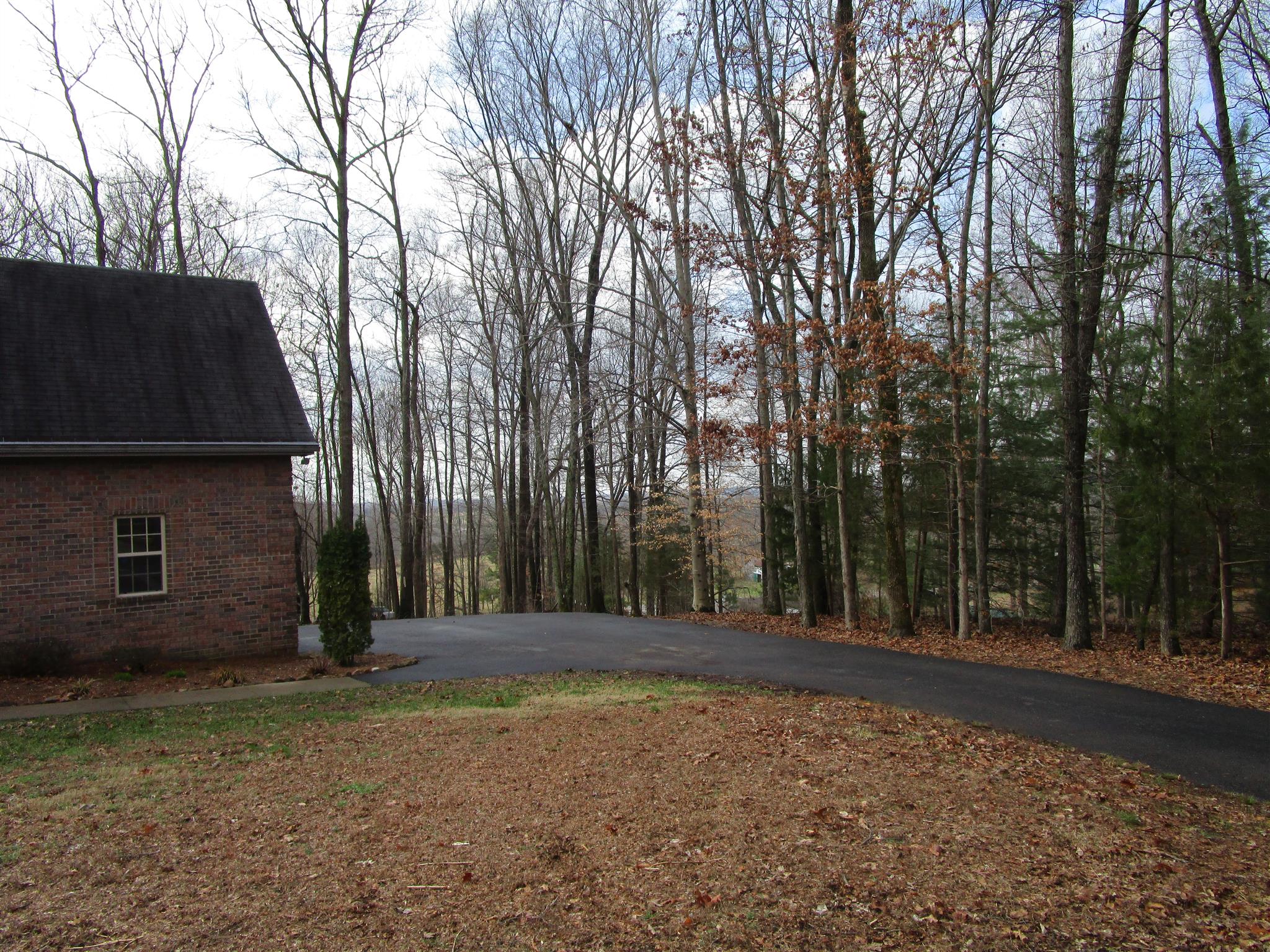 136 North Leath Road Portland, TN 37148 - Photo 9 of 30 a backyard of a house with lots of green space
