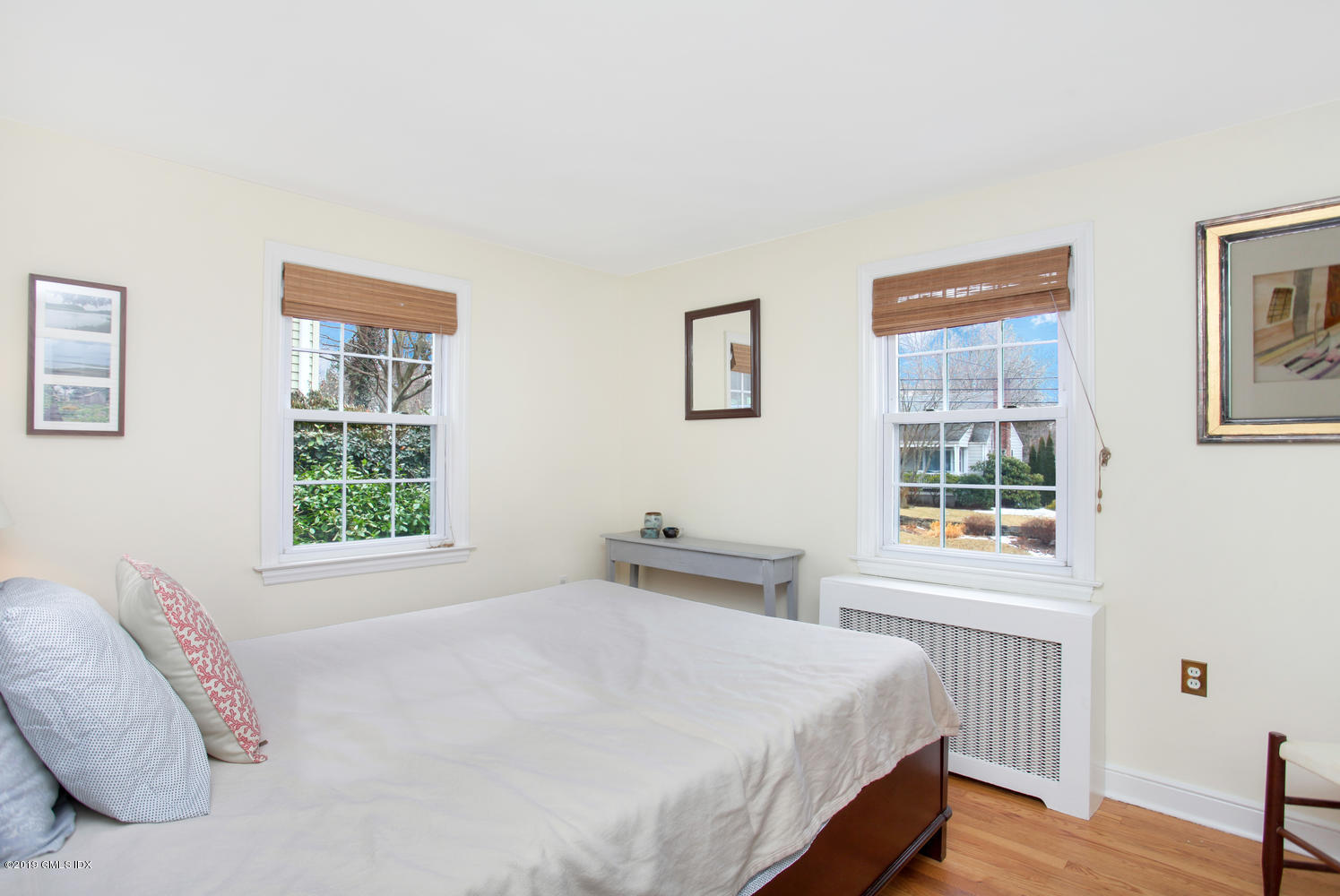 13 Hoover Road Riverside, CT 06878 - Photo 14 of 25 a bedroom with a bed and a window