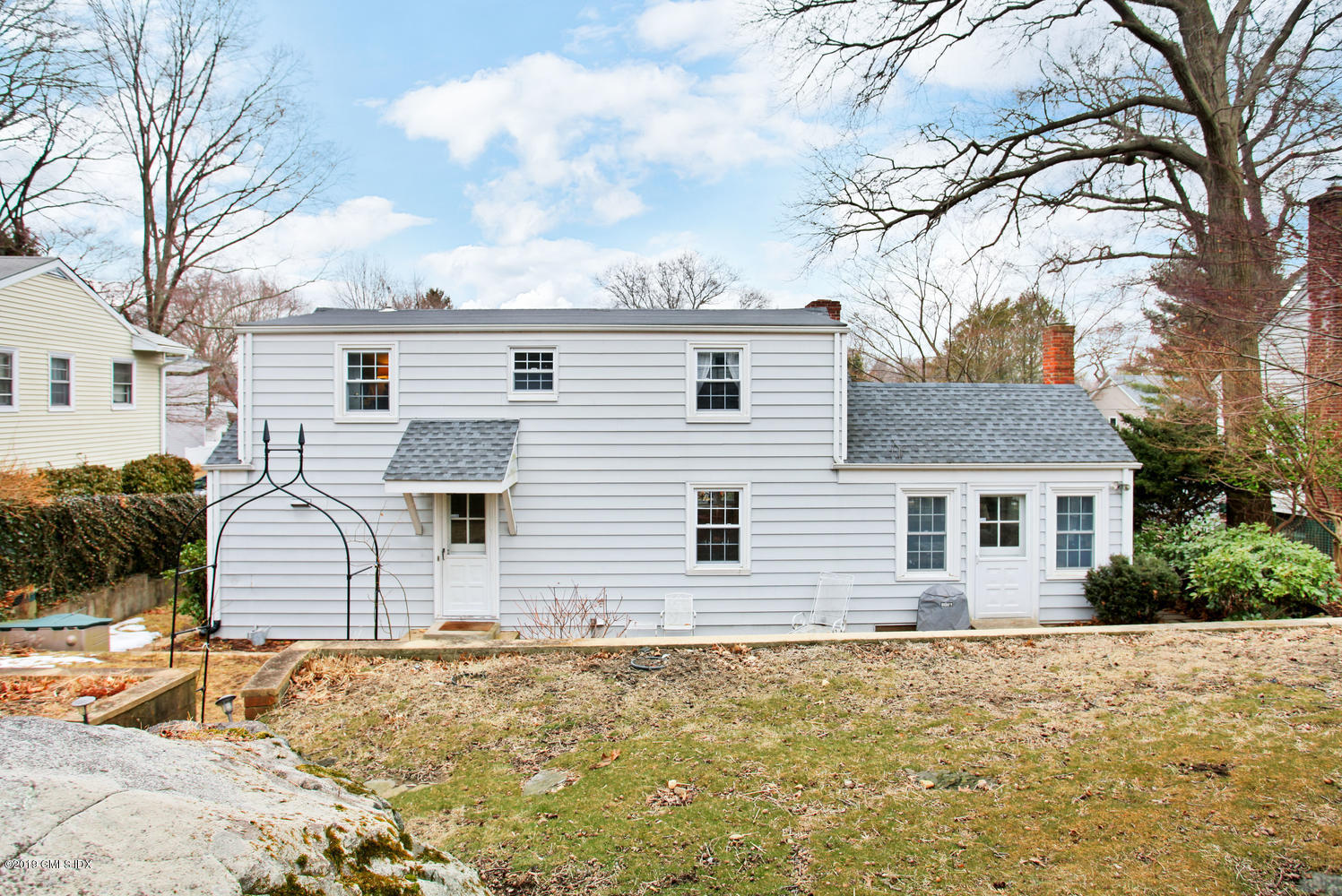 13 Hoover Road Riverside, CT 06878 - Photo 21 of 25 a front view of a house with a yard covered with snow